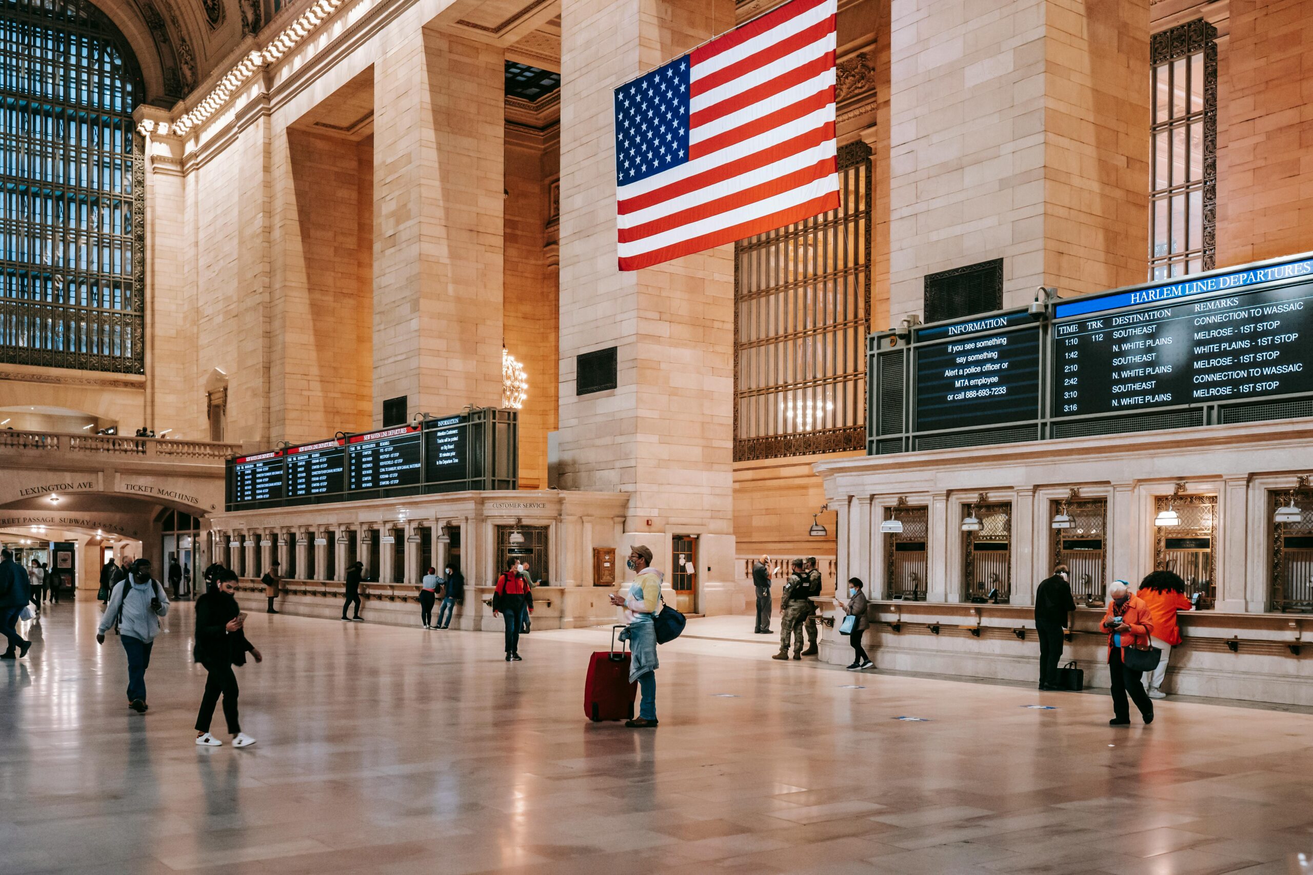 Interior of classic Grand Central Terminal building with brick columns and ornamental walls over parquet on floor