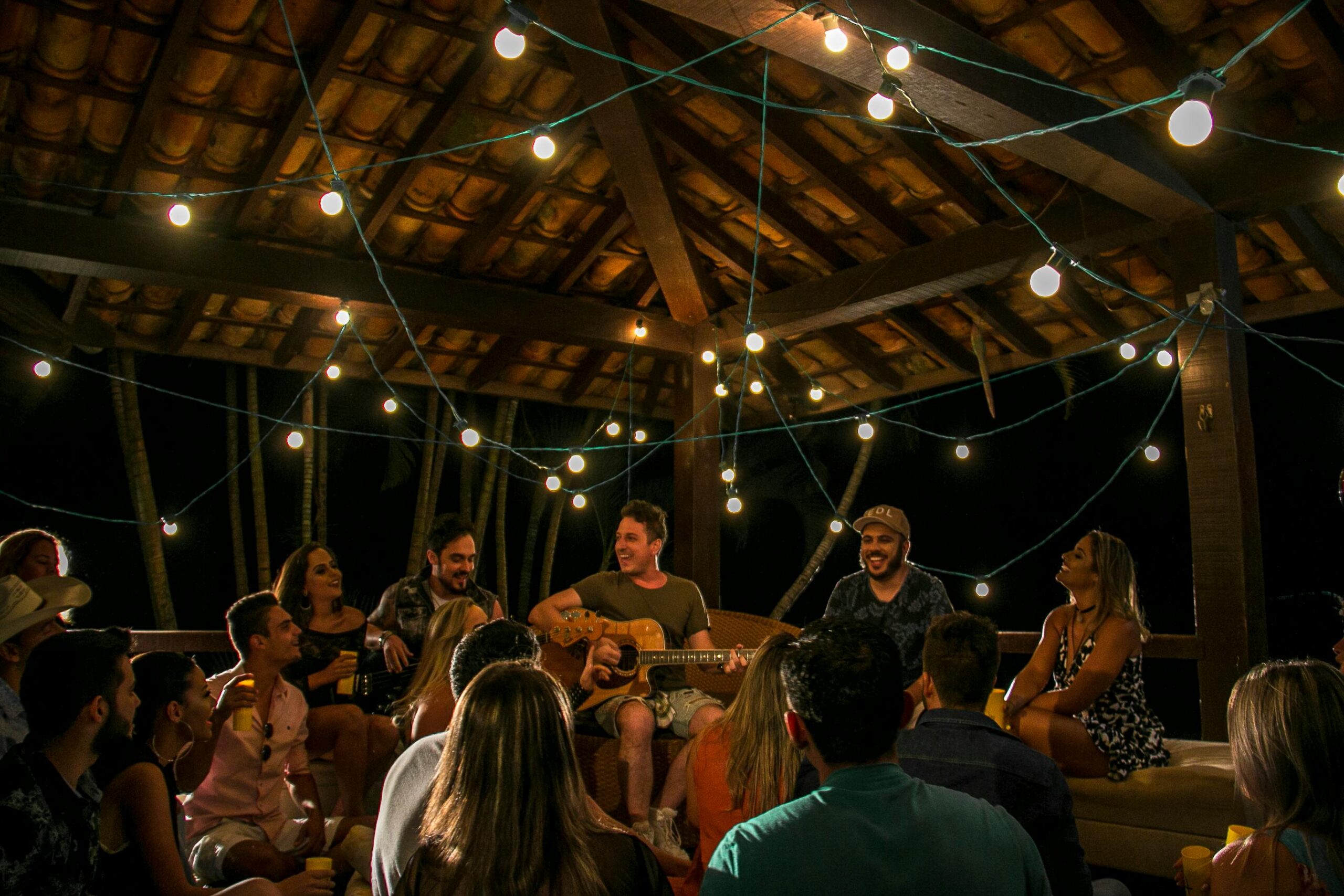 Party Bus Bachelor Parties Brooklyn: Your 2025 Guide to Unforgettable Nights 2 An intimate musical gathering under string lights in São Paulo, Brazil.