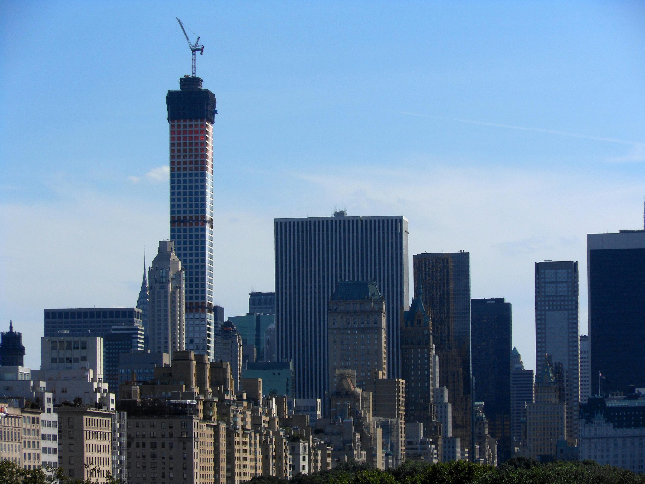 Stunning view of New York City skyline with a prominent skyscraper under construction.