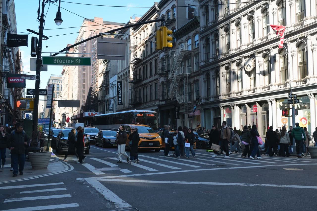 Bus Companies NYC Reviews 2026: A First-Timer's Honest 2026 Test 2 Crowded intersection on Broome Street in bustling SoHo, NYC, during the day.