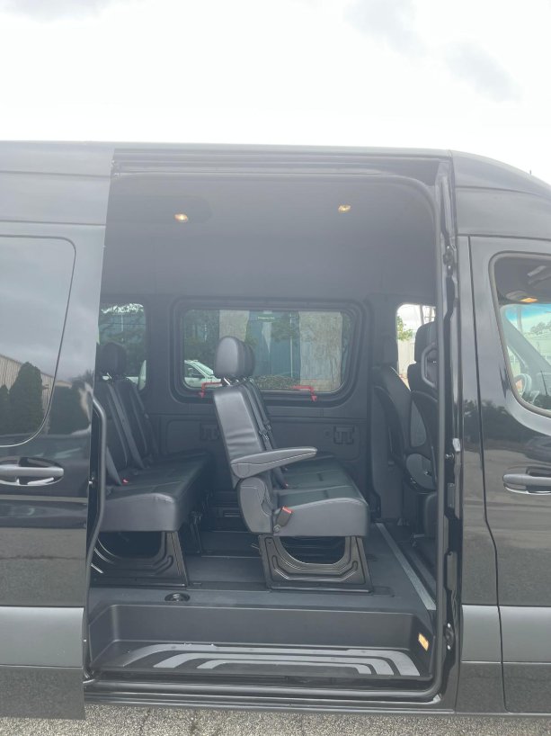 Van sliding door open showing interior seats - Zolo